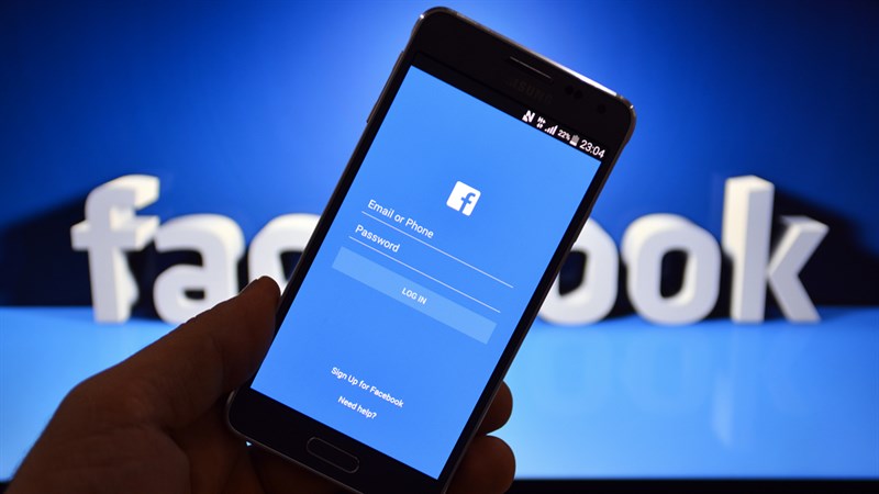 Smartphone screen displaying the Facebook app search bar with a phone number being entered, representing the process of searching for an account by phone number