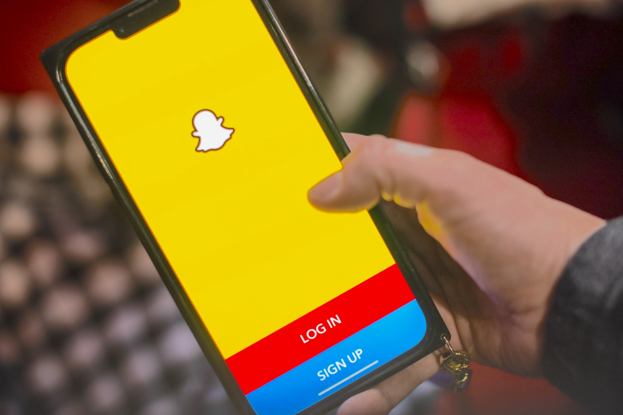 User updating Snapchat app on iPhone or Android
